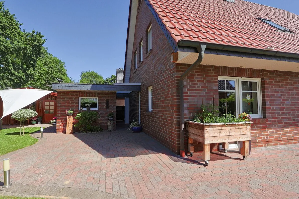 Immobilienangebot - Wiefelstede - Alle - Familienfreundliches Einfamilienhaus mit schönem Garten und Doppelcarport in Metjendorf