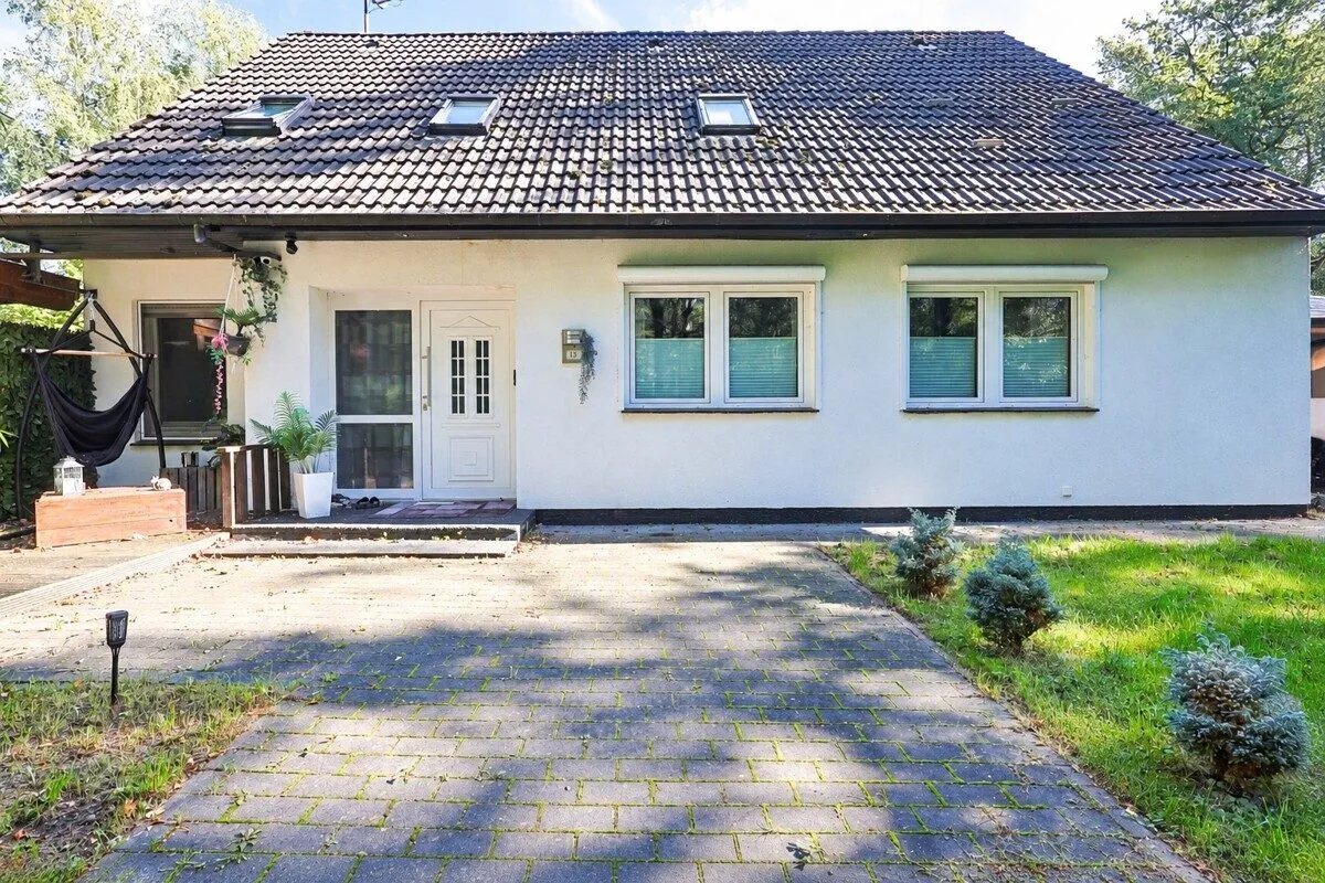 Immobilienangebot - Hatten - Alle - Wohnen am Waldrand in ruhiger Lage – großzügiges Wohnhaus mit Wintergarten